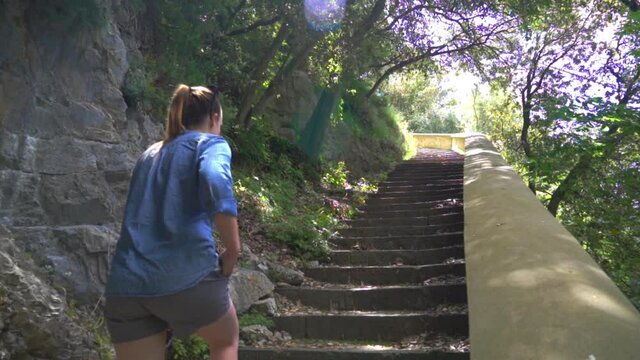 Woman Walking Up On The Stairway (Path Of The Gods) To Il Sentiero Degli Dei In Positano, Amalfi Coast, Italy - low angle slowmo shot