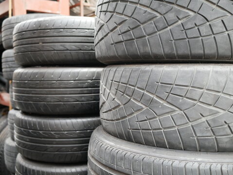 pile of used car tires in the tire repair shop.