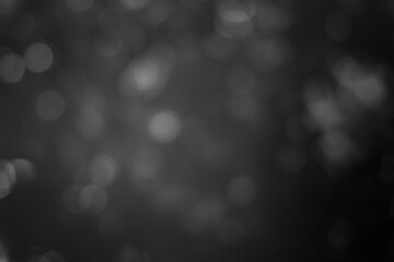 Dark blurred christmas lights background. Design effect focus happy holiday party glow texture...