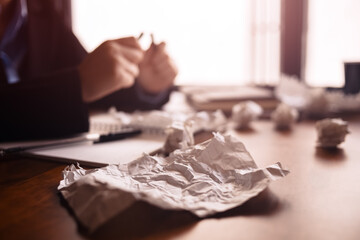 crumpled paper on table. Concept of no idea.