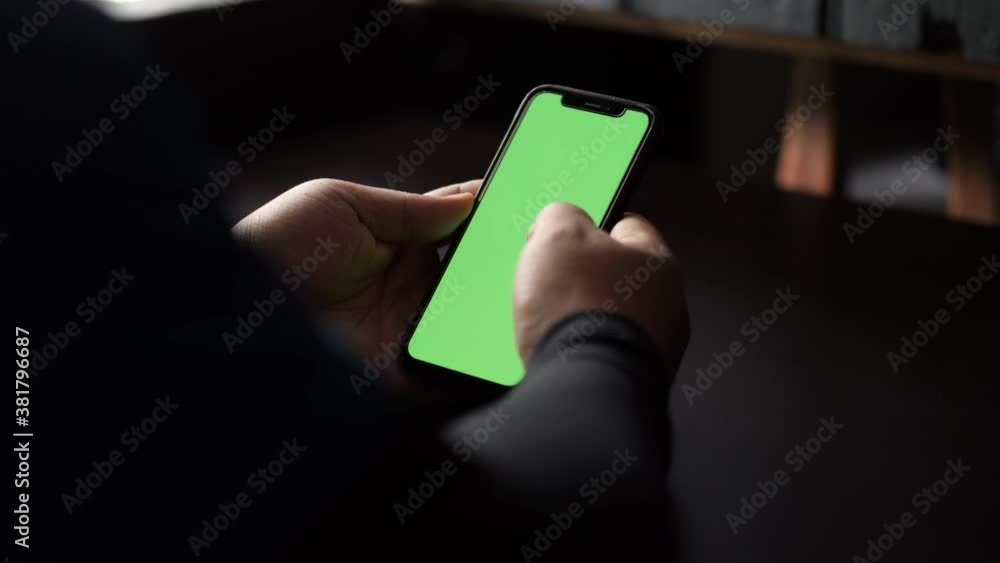 Aufkleber close up and slide movement of a man using a smartphone. chroma key green screen on the smartphone s