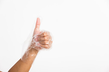 Plakat hand wearing disposable plastic glove with thumb up gesture