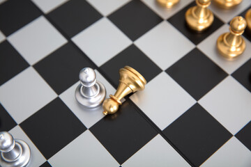 Chess pieces on both sides of the chess board