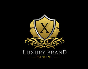 Royal Beauty Logo With X Letter. Elegant Gold Shield badge With Beauty Face Shape perfect for salon, spa, cosmetic, Boutique, Jewelry.
