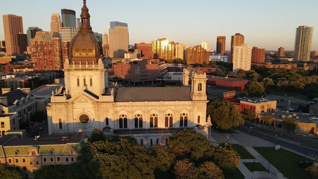 St Marys cathedral during golden hour in minneapolis, mn, downtown in the background