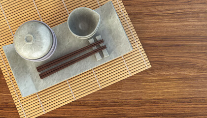 Japanese table setting. Concept image for traditional dining guide or oriental ceramics tableware set with main dish, side dishes, pickle, soup and chopsticks on bamboo mat. 3D rendering.