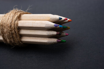 Bundle of colored pencils wrapped with linen string