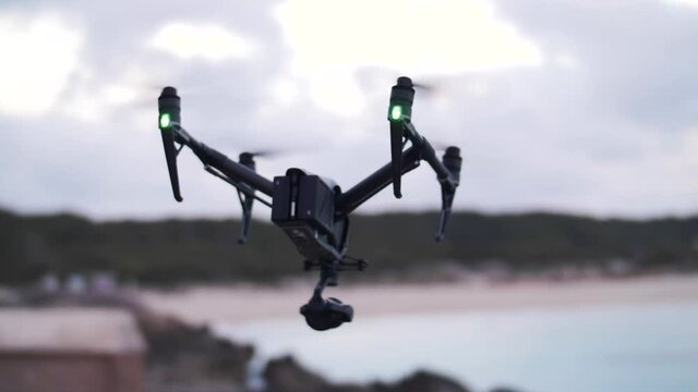Slow Motion footage of flying quadcopter - DJI Inspire 2 - Professional film production equipment - Flyying away