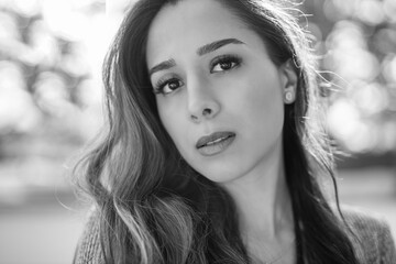 Obraz premium Beautiful woman face. Perfect makeup, artistic black and white beauty portrait, charming look with long brunette hair. Glamour fashion portrait of beautiful woman model with fresh daily make-up