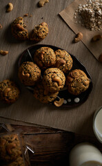 Oatmeal sesame cookies. Healthy homemade dessert decorated with sesame seeds. set on rustic wooden background.
