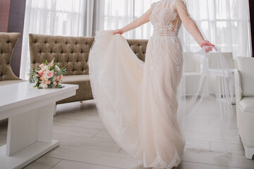 Fototapeta na wymiar bride in a beautiful wedding dress and veil
