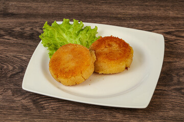 Vegan cuisine - Potato cutlet in the plate