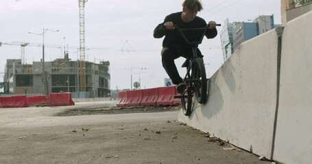 Extreme bmx cyclist doing bike tricks