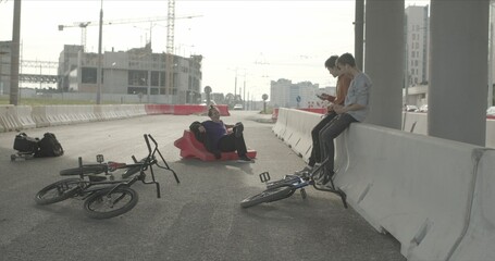 Tired bored friends with bikes