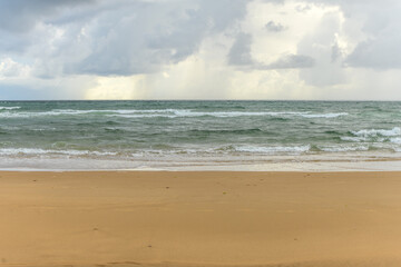 Fototapeta na wymiar Sunny beach in front of the Atlantic Ocean.