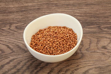 Raw buсkwheat cereal in the bowl