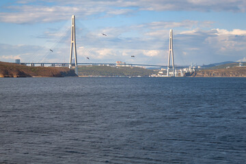 View from the Russian island to the bridge over the Eastern Bosphorus. Vladivostok, Russia