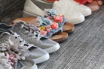 Variety of woman fashion shoes , sandal on gray background