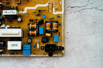 Kuala Lumpur, Malaysia - Sept 29, 2020: The TV motherboard of LCD TV on a concrete background.