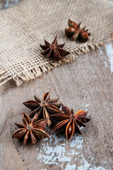 Anise stars on rustic background