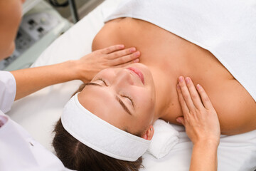 Fototapeta na wymiar Beautician massage young client body in salon