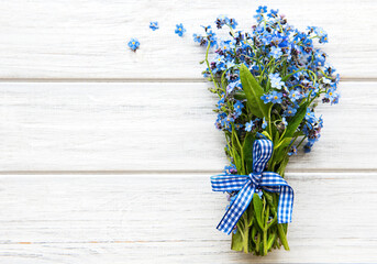 Forget-me-not flowers on a wooden table