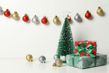 Christmas trees, gifts and baubles on white background