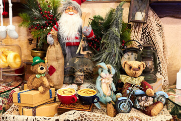 Two cups of cappuccino with drawings of hearts on a table among toys and New Year's decorations