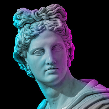Statue of of Apollo God of Sun. Creative concept colorful neon image with ancient greek sculpture Apollo Belvedere head. Webpunk, vaporwave and surreal art style. Isolated on a black.