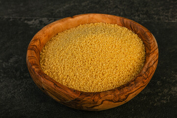 Raw cous cous heap in the bowl
