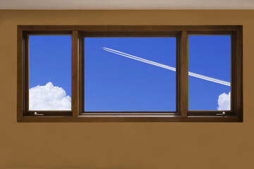 窓から飛行機雲