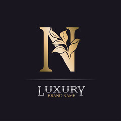 Golden Initial Letter N. Elegant design letter N with floral branch. Luxury Gold Logo Icon. Vintage alphabet concept with floral ornate for monogram, initial, heraldy, logo, business, wedding card.