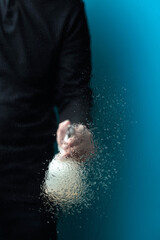 Fototapeta na wymiar Man in rubber glove sprays disinfectant on a glass, selective focus.