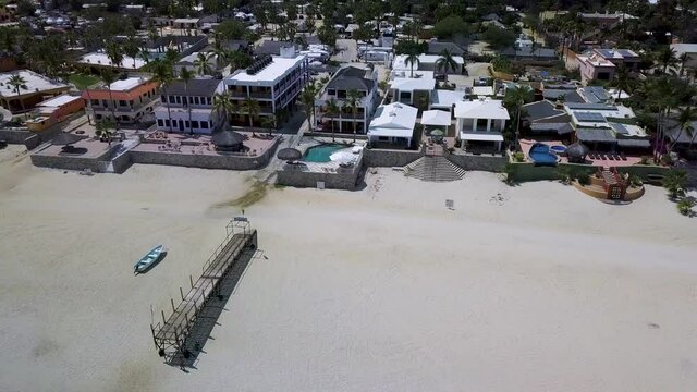 Beach Houses in Coastal Town of Baja California in Mexico, Aerial Drone Flying View
