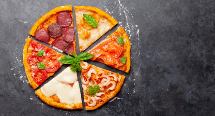 Tasty slices of different pizza
