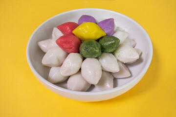 Songpyeon is half-moon shaped rice cake and stuffed with sesame seeds and sugar, sweet beans or...
