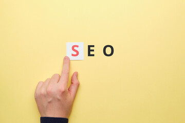 Person points finger at search engine optimization