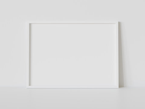 White frame leaning on white floor in interior mockup. Template of a picture framed on a wall 3D rendering