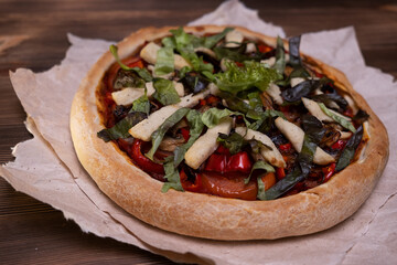 Vegan pizza on a wooden table
