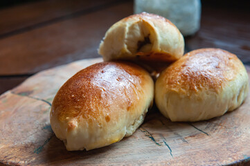 Freshly baked pies on a glass stand with a napkin. Close-up of baked pies