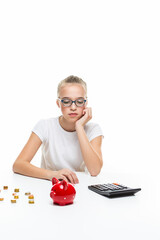 Portrait of Teenage Girl Posing With Coins and Moneybox. Calculating Income With Calculator.