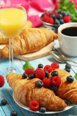 Croissants with fresh berries for breakfast