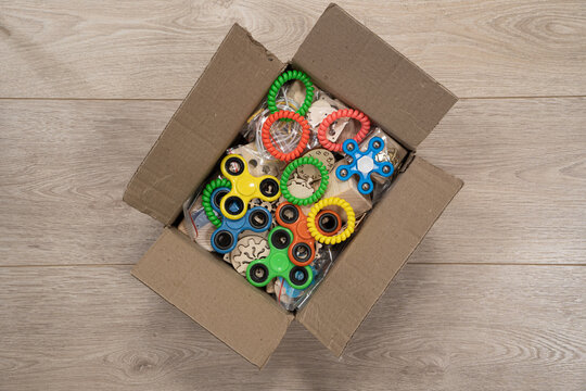 Cardboard box with wooden parts for handmade and multi-colored spinners . Warm and cozy atmosphere. Made by hand and with love. Handmade christmas gifts