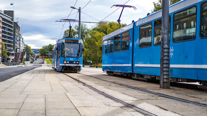 Fototapeta na wymiar Two trams meet at the town hall square