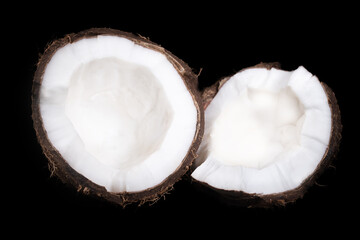 Half of coconut isolated on deep black background