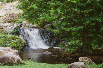 Waterfall stream flow with rock. Klong nam lai waterfall in Kamphaeng Phet, Thailand. Slow speed shutter concept.