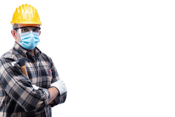 Carpenter worker isolated on white background, wears helmet, goggles, leather gloves and surgical mask to prevent coronavirus infection. Preventing Pandemic Covid-19 at the workplace.