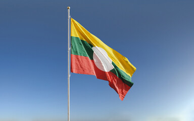 Waving flags of Shan State in Myanmar against blue sky background.