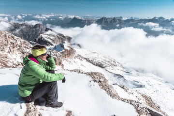 Fototapeta na wymiar hiking woman having rest in mountains Dolomites, Italy