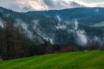 Fog lingers in the mountains of the Black Forest, Germany, in early May